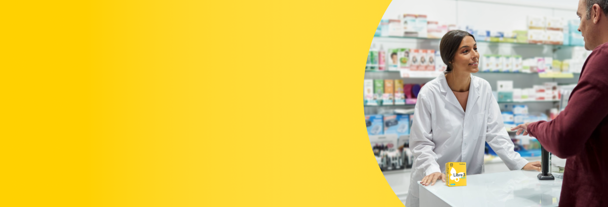 Man speaking to his pharmacist about FreeStyle Libre 3 Plus sensors