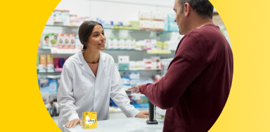 Man speaking to his pharmacist about FreeStyle Libre 3 Plus sensors