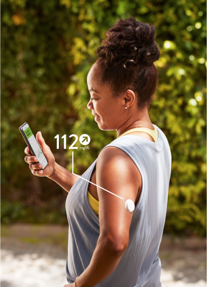 Woman checking her blood glucose on the FreeStyle Libre app